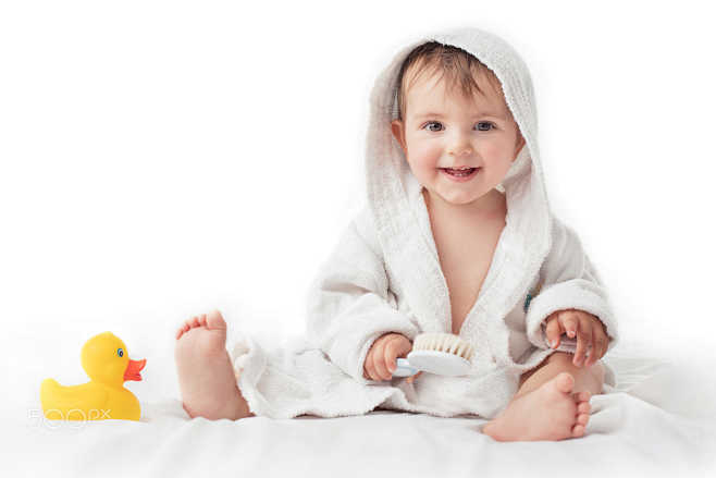 littlebabysmilingunderawhitetowel