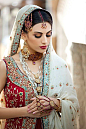 An absolutely stunning red and cream bridal lengha…