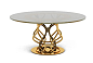LA COUPE DES  DIEUX - Versace Home Collection : Tavolo da pranzo in metallo con base in due colori (bronzo e oro chiaro). Piano in vetro stopsol color bronzo. Dimensione:Ø140xh72 cm