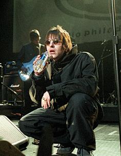 lagher, liam gallagher and andy bell of oasis pose at wembl y