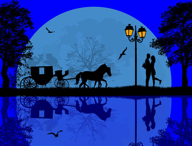 路灯下的人物剪影和马车图片