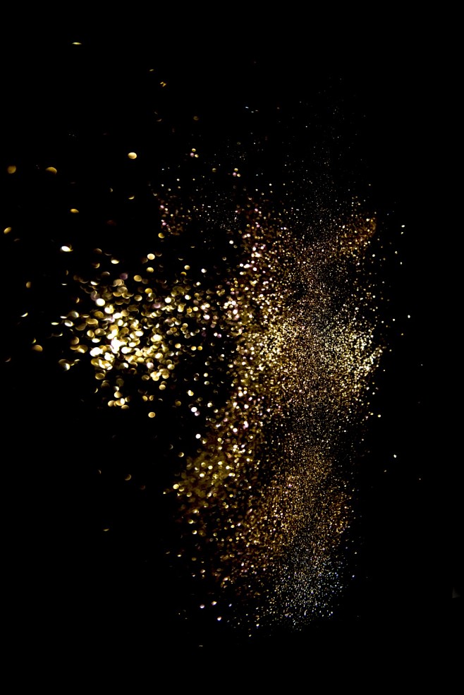 金粉质感黑底背景金色粉状泼洒背景